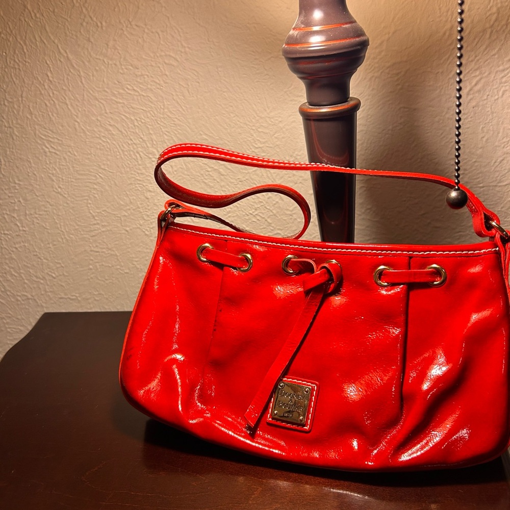 Dooney and Bourke Patent Leather Tassel shoulder bag